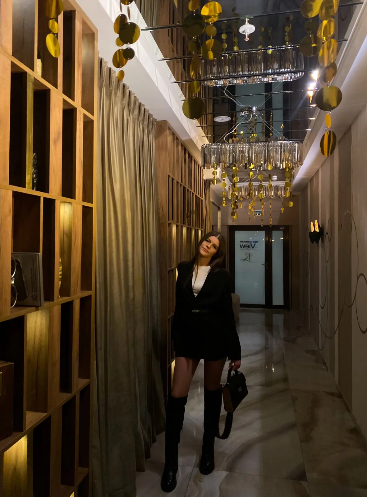 Kseniya Savitskaya in an elegant interior